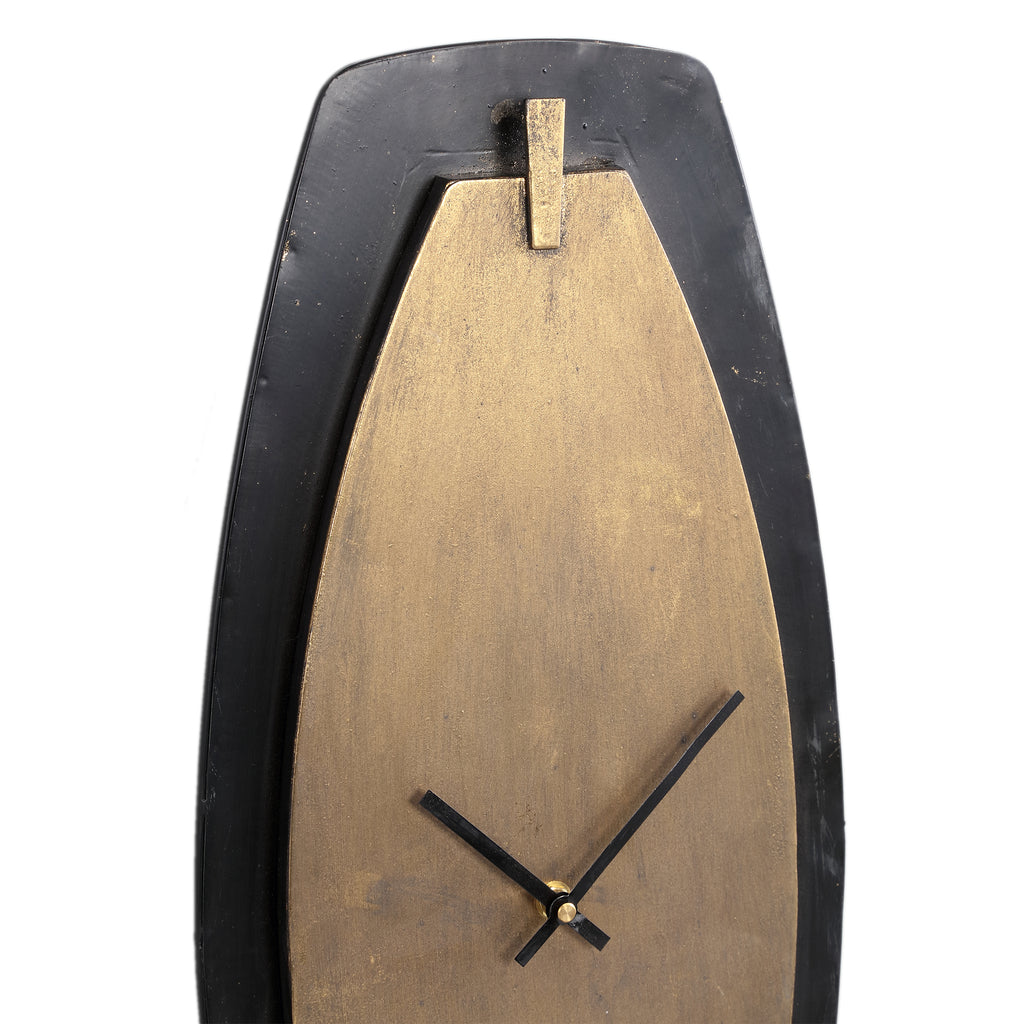 Zanni Gold metal wall clock on black shaped oval